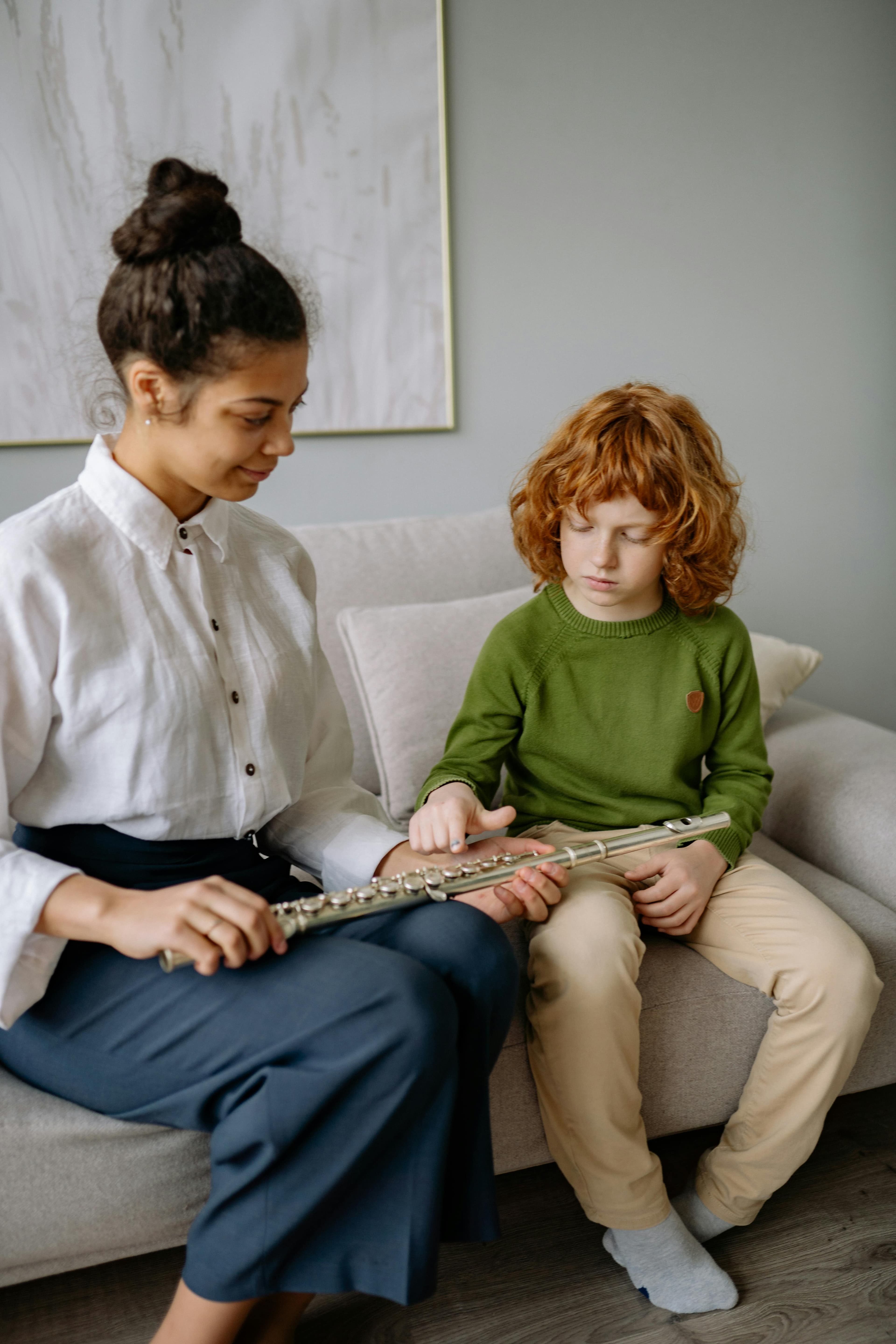 A tutor helping a young student during a one-on-one lesson